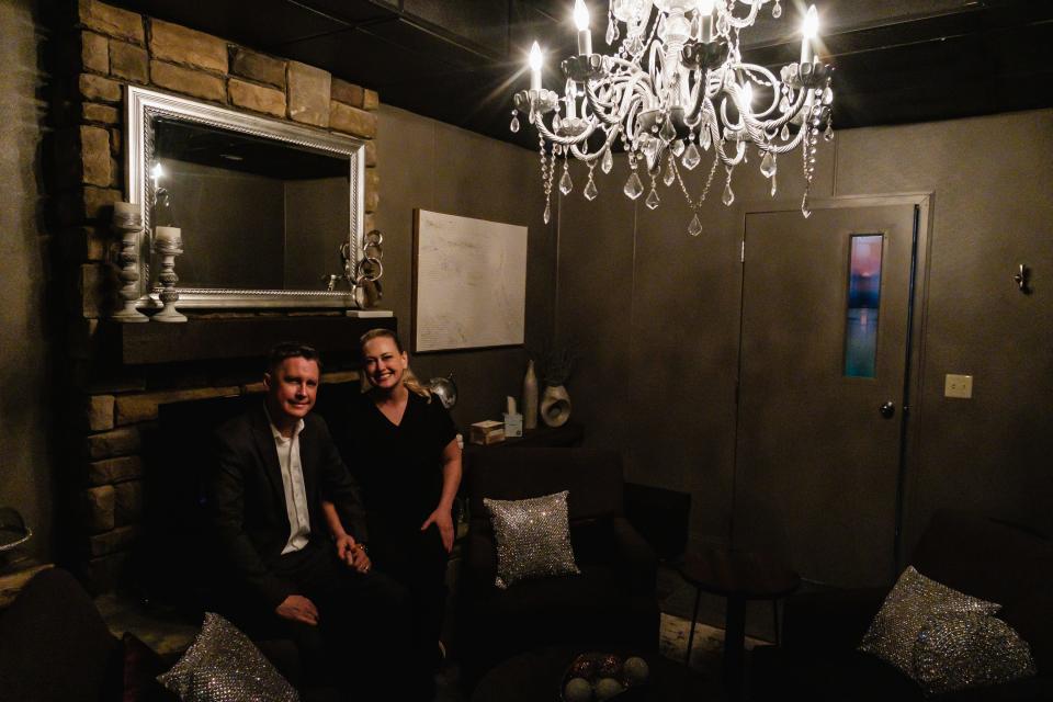 Michelle and Michael Gossett of Solace Relaxation Massage & Float Spa sit for a portrait in the Lavender Relaxation Room at the New Philadelphia business.