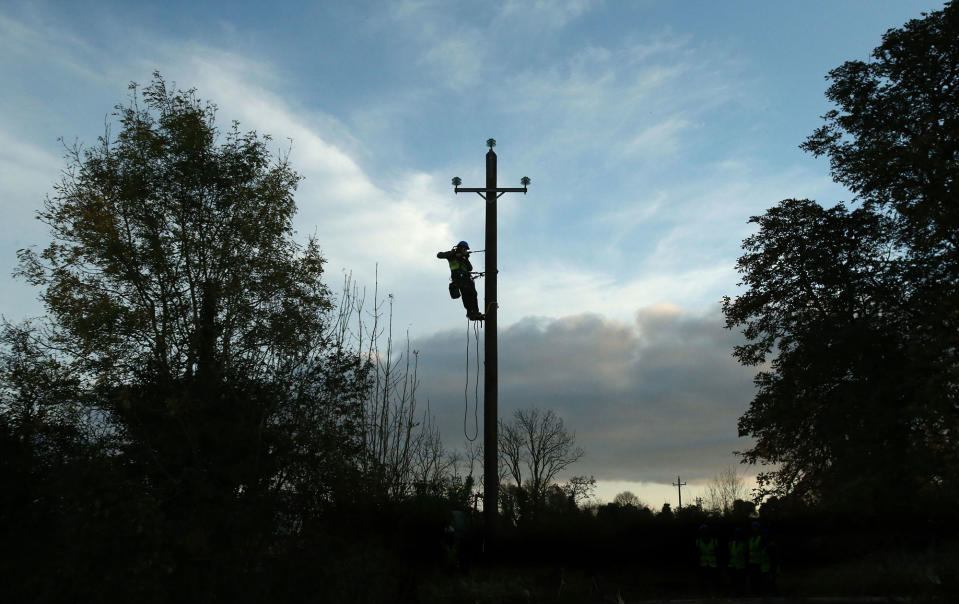 <p>Workers in Kilcock, Ireland, clear fallen power lines after Hurricane Ophelia batterred the UK and Ireland with gusts of up to 80mph on Oct. 17, 2017. (Photo: Niall Carson/PA Images via Getty Images) </p>