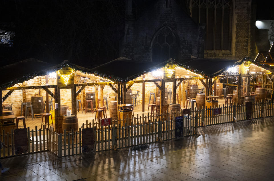 CARDIFF, WALES - DECEMBER 04: A general view of an empty Christmas market bar on the Hayes on December 4, 2020 in Cardiff, Wales. Following a firebreak period that ran from October 23 to November 9 the Welsh Government have introduced new rules which will prevent pubs, restaurants and cafes from selling alcohol at any time from 6pm on Friday. The rules will be reviewed on December 17. (Photo by Matthew Horwood/Getty Images)