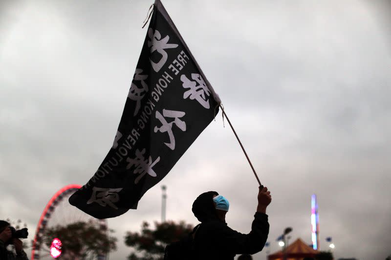 Protesters rally to remember the deaths and injuries during the months of protests, in Edinburgh Place in Hong Kong