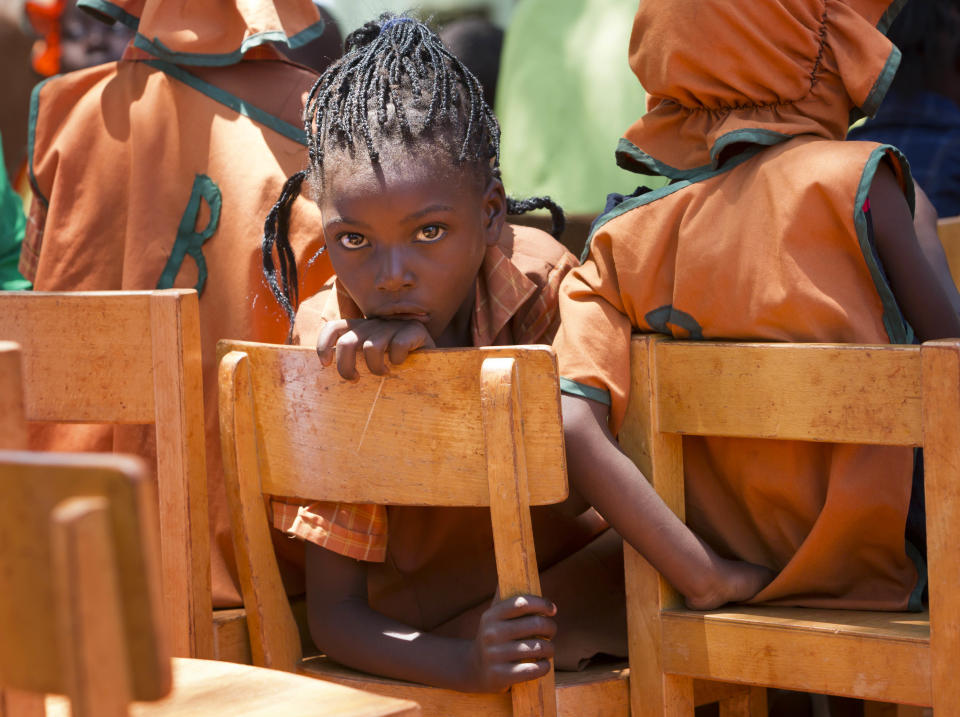 A young schoolgirl listens to a&nbsp;concert at the Glen Forest Development Centre on December 3, 2012 in Harare, Zimbabwe.