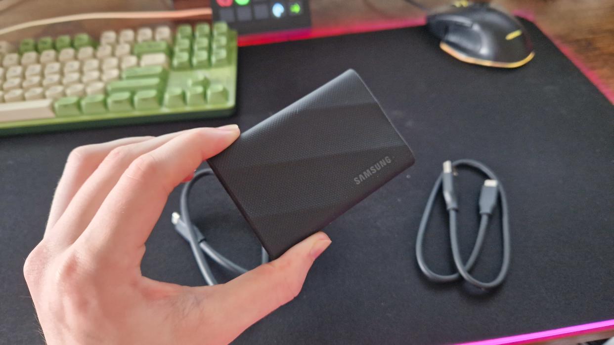  Samsung T9 being held by a reviewer. 