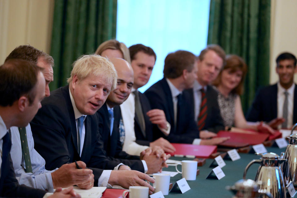 Prime Minister Boris Johnson (third left) holds his first Cabinet meeting at Downing Street in London.