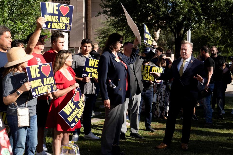 PHOTO: Republican Arizona state Senator Anthony Kern speaks with anti-abortion protesters at the Arizona State Capitol in Phoenix, AZ, April 24, 2024.  (Rebecca Noble/Reuters)