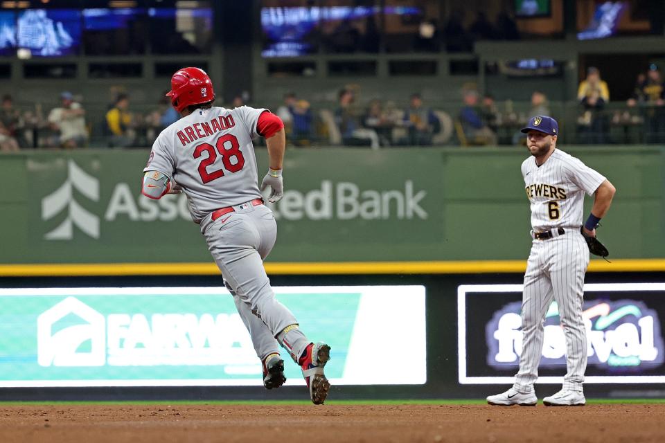 Cardinals third baseman Nolan Arenado rounds the bases in front of Brewers second baseman Owen Miller after belting a two-run home run in the third inning Saturday night at American Family Field.