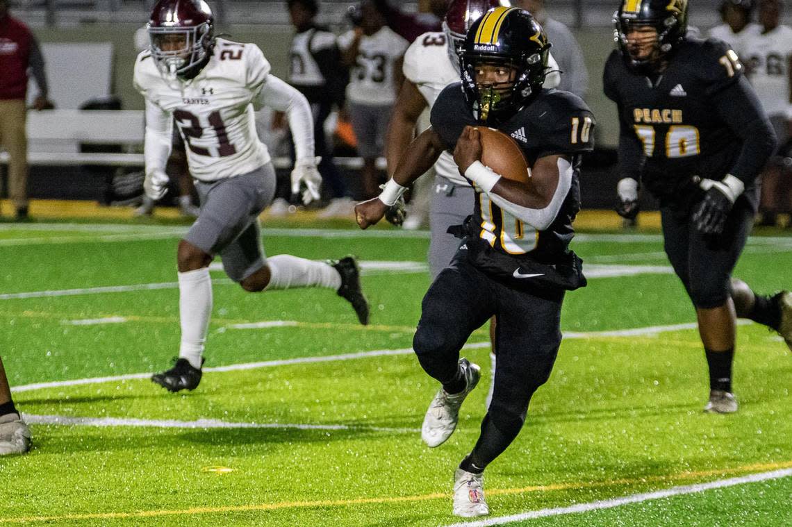 CLAY TEAGUE/FOR THE TELEGRAPH Fort Valley, GA, 9/29/22 Peach County’s Robert Jones looks for running room against Carver Thursday night.