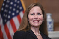 Judge Amy Coney Barrett, President Donald Trumps nominee for the U.S. Supreme Court, is shown while meeting with Sen. Mitt Romney, R-Utah, on Capitol Hill in Washington, Wednesday, Sept. 30, 2020. (Erin Scott/Pool via AP)