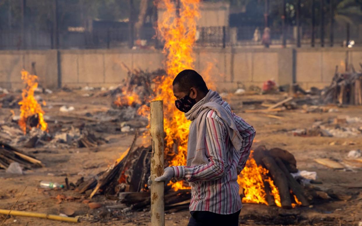 Burning funeral pyres of people, who died due to the coronavirus disease, at a crematorium ground in New Delhi - Danish Siddiqui/Reuters