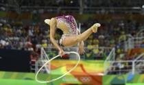 <p>Margarita Mamun (RUS) of Russia competes using the hoop. (Reuters) </p>