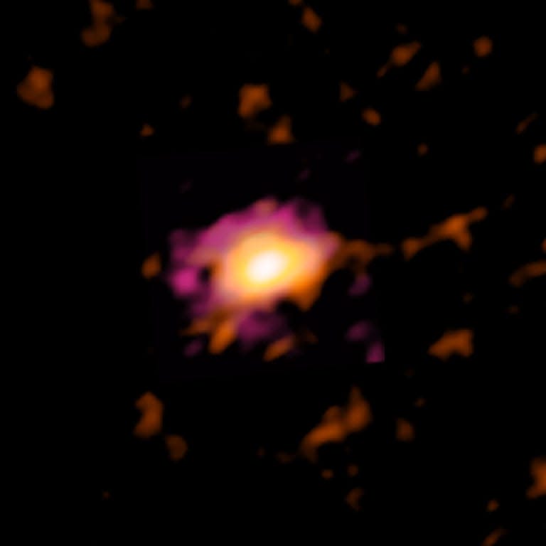 ALMA radio image of the Wolfe Disk, seen when the universe was only 10% of its current age. (ALMA (ESO/NAOJ/NRAO), M. Neeleman; NRAO/AUI/NSF, S. Dagnello)