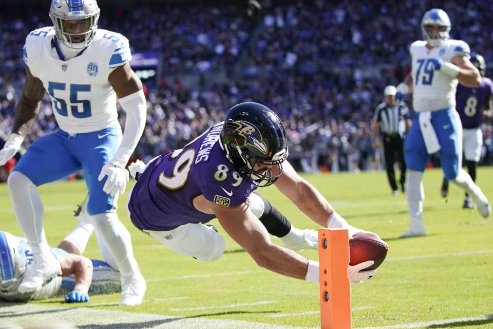 Baltimore Ravens tight end Mark Andrews (89) stretches for a touchdown as Detroit Lions linebacker Derrick Barnes (55) defends during the first half of an NFL football game, Sunday, Oct. 22, 2023, in Baltimore. (AP Photo/Alex Brandon)