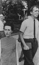 <p>Rita Schwerner, wife of missing civil rights worker Michael Schwerner, tried unsuccessfully in Jackson, Miss., to confer with Gov. Paul Johnson, June 25, 1964. At right is the Rev. Edwin King, chaplain of the predominately black Tougaloo College, and integration leader. In background far left is former welfare commissioner Fred Ross. (Photo: AP) </p>