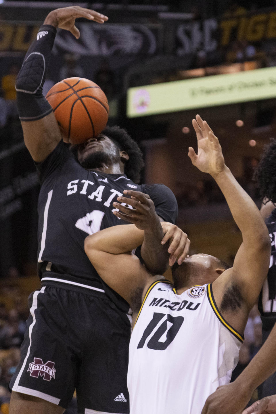 Mississippi State's Cameron Matthews, left, and Missouri's Nick Honor vie for a rebound during the first half of an NCAA college basketball game Tuesday, Feb. 21, 2023, in Columbia, Mo. (AP Photo/L.G. Patterson)