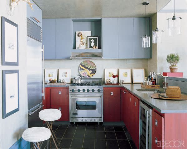 <p>Red makes the perfect sibling to cool blue in this New York City kitchen designed by <a rel="nofollow noopener" href="http://www.thomfilicia.com" target="_blank" data-ylk="slk:Thom Filicia;elm:context_link;itc:0;sec:content-canvas" class="link ">Thom Filicia</a>. The range and hood are by Viking, the light fixtures are custom made, the stools are from <a rel="nofollow noopener" href="http://www.larsbolander.com" target="_blank" data-ylk="slk:Lars Bolander;elm:context_link;itc:0;sec:content-canvas" class="link ">Lars Bolander</a> and the floor is paved in slate tile. </p>