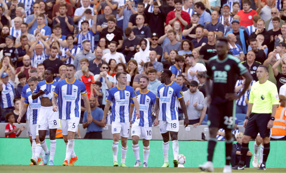 Brighton and Hove Albion's Alexis Mac Allister, center, celebrates scoring their side's fourth goal of the game during the English Premier League soccer match between Brighton & Hove Albion and Leicester City at The Amex Stadium, Brighton, England, Sunday, Sept. 4, 2022. (Steven Paston/PA via AP)