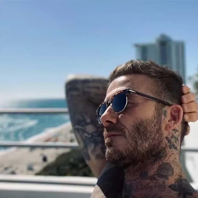 david beckham sunbathing on balcony in miami