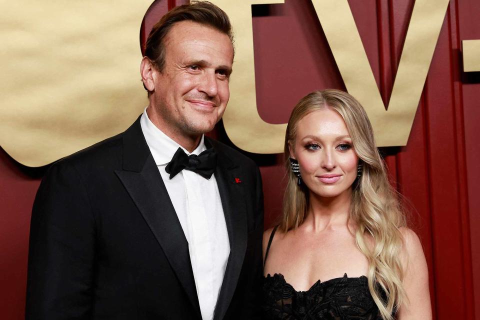 <p>MICHAEL TRAN/AFP/Getty</p> Jason Segel and Kayla Radomski attend the Apple TV+ 75th Emmy Awards red carpet event in Los Angeles on Jan. 15, 2024.