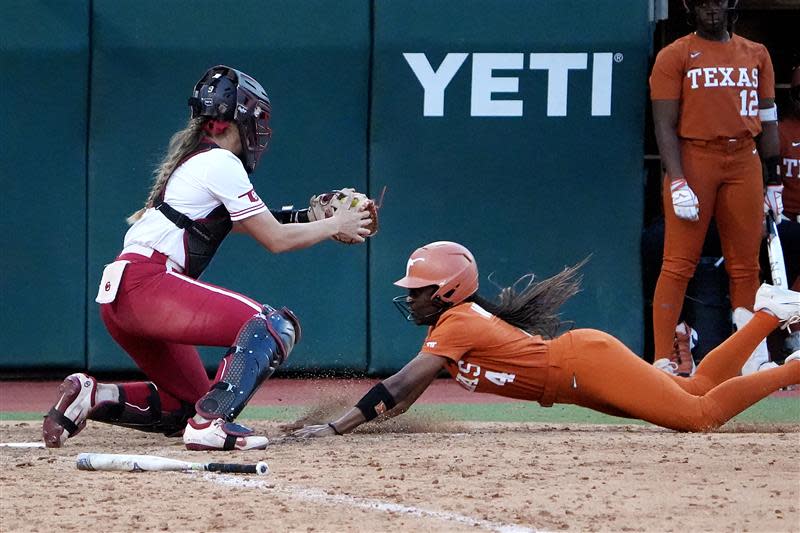 Texas outfielder Adayah Wallace slides into home during Friday night's 5-2 loss to top-ranked Oklahoma on April 5, 2024 at McCombs Field in Austin, Texas.