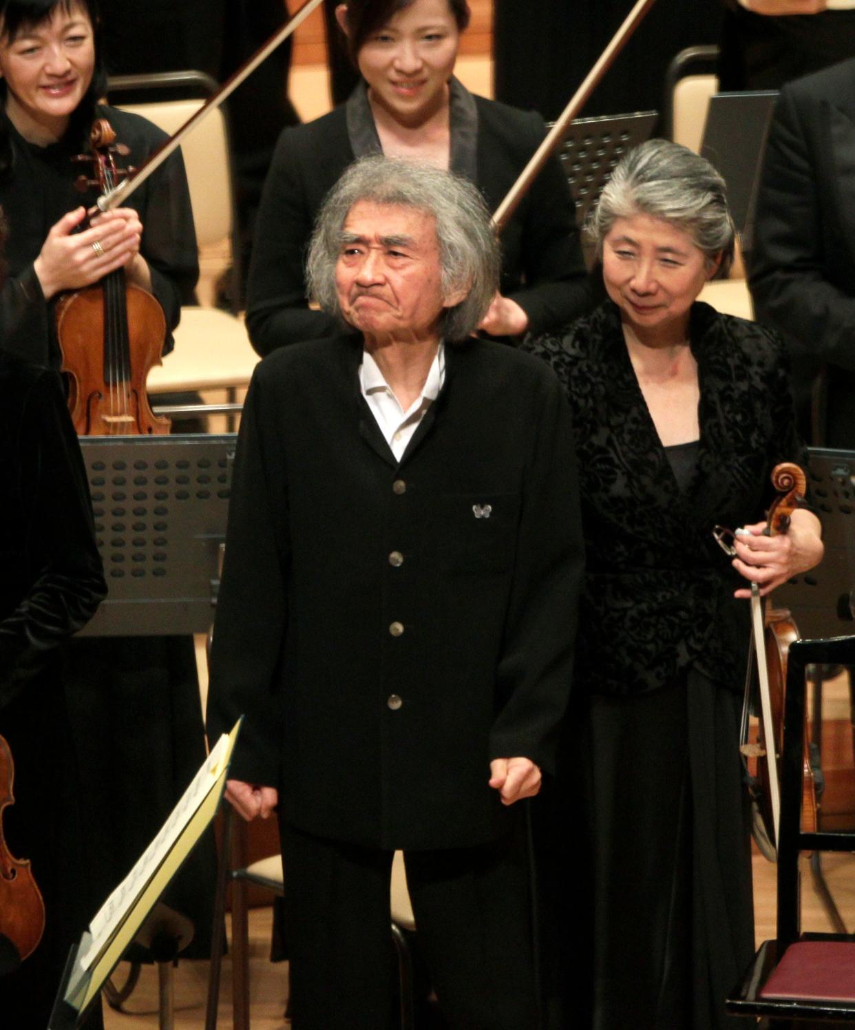 Seiji Ozawa, center, reacts as he greets the audience after a performance with violoncellist Dai Miyata, unseen, and the Mito Chamber Orchestra at Suntory Hall in Tokyo, Sunday, Jan. 22, 2012. World-renowned conductor Ozawa has died of heart failure at his home in Tokyo, his management office said Friday, Feb. 9, 2024. He was 88.