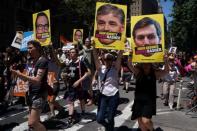 Participants take part in the LGBT Pride March in the Manhattan borough of New York City, U.S., June 25, 2017. REUTERS/Carlo Allegri