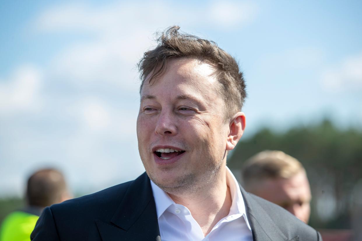 Tesla head Elon Musk talks to the press as he arrives to to have a look at the construction site of the new Tesla Gigafactory near Berlin (Getty Images)