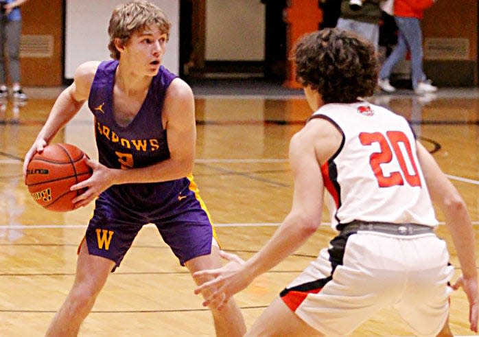 Watertown's Brody Torgerson (2) is pressured by Huron's Colton McNeil during their high school boys basketball game on Tuesday, Jan. 24, 2023 at Huron.