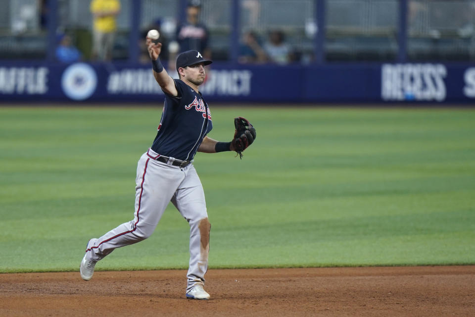 Atlanta Braves third baseman Austin Riley throws to first base to put out Miami Marlins' Jesus Aguilar during the third inning of a baseball game, Sunday, Aug. 14, 2022, in Miami. (AP Photo/Wilfredo Lee)