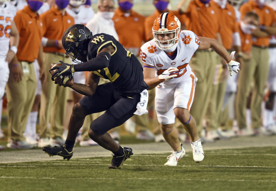 Wake Forest's A.J. Williams picks off a pass intended for Clemson's Will Brown during the second half of an NCAA college football game Saturday, Sept. 12, 2020, in Winston-Salem, N.C. (Walt Unks/The Winston-Salem Journal via AP)