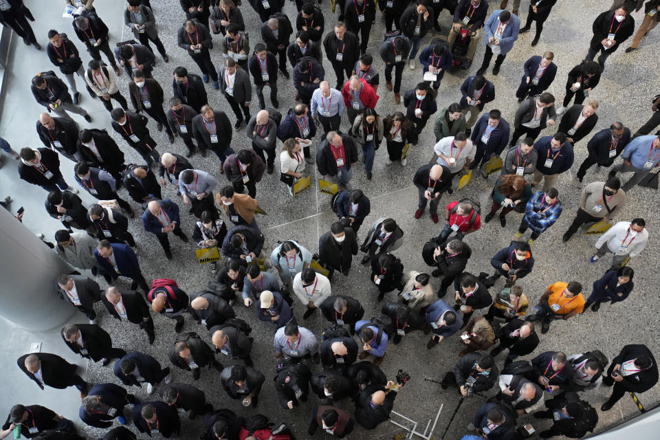 People wait to enter the show floor before the start of the CES tech show Thursday, Jan. 5, 2023, in Las Vegas. (AP Photo/John Locher)