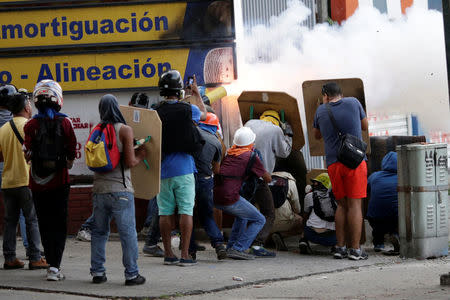 Demonstrators fire homemade explosive at a rally during a strike called to protest against Venezuelan President Nicolas Maduro's government in Caracas, Venezuela July 27, 2017 . REUTERS/Ueslei Marcelino