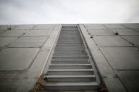 The Wider Image: Japan's tsunami survivors call lost loves on the phone of the wind