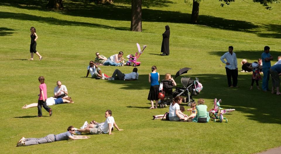 People take advantage of sunny weather in Roundhay Park, Leeds (PA)