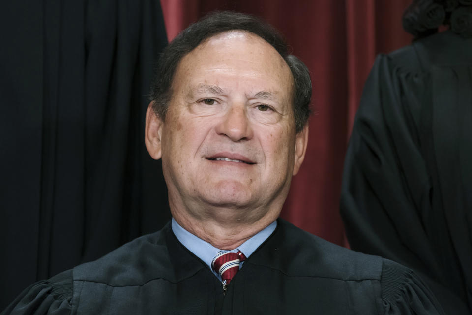 FILE - Associate Justice Samuel Alito joins other members of the Supreme Court as they pose for a new group portrait, Oct. 7, 2022, at the Supreme Court building in Washington. The annual financial reports for Supreme Court Justice Clarence Thomas and Alito were released Thursday, Aug. 31, 2023, nearly three months after those of the other seven justices. Thomas and Alito were granted 90-day extensions. (AP Photo/J. Scott Applewhite, File)