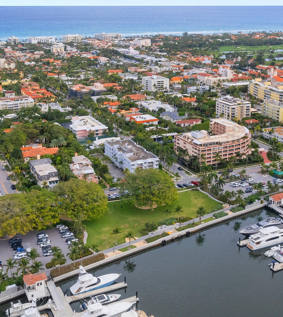 Facing the Intracoastal Waterway in Midtown Palm Beach, the Lake Drive Apartments at 455 Australian Ave. can be seen in the center by a tree in Lake Drive Park.