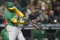 Oakland Athletics' Elvis Andrus hits a single to score Sean Murphy during the seventh inning of the team's baseball game against the Seattle Mariners, Tuesday, May 24, 2022, in Seattle. (AP Photo/Ted S. Warren)