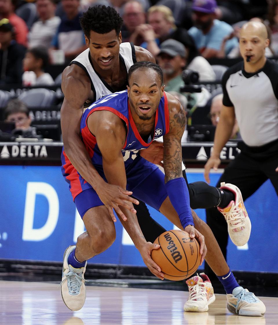 Utah Jazz guard Ochai Agbaji (30) fouls Philadelphia 76ers guard Javonte Smart (39) as the Utah Jazz and Philadelphia 76ers play in Summer League action at the Delta Center in Salt Lake City on Wednesday, July 5, 2023. 76ers won 104-94. | Scott G Winterton, Deseret News