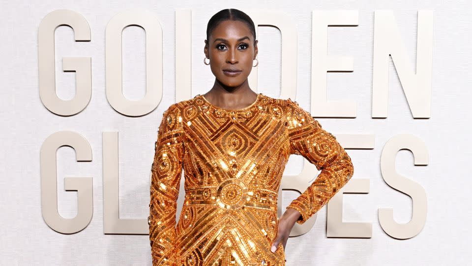 Issa Rae looked statuesque in a floor-length gold Pamella Roland gown. - Gilbert Flores/Golden Globes/Getty Images