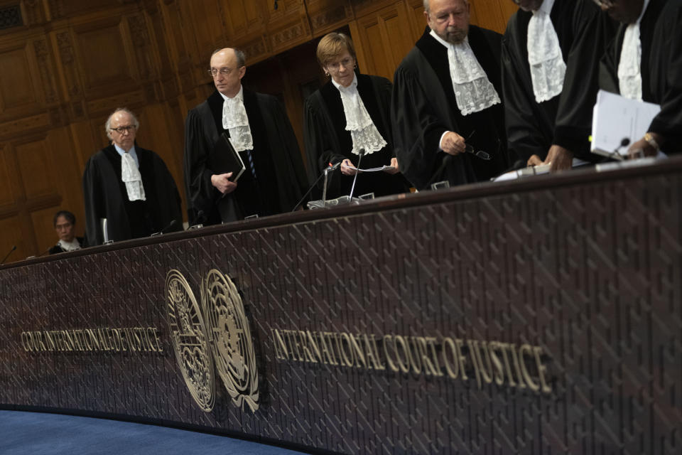 Presiding judge Joan Donoghue, center, is followed by judge Peter Tomka at the United Nations top court which is ruling in The Hague, Netherlands, Wednesday, Jan. 31, 2024. The United Nations’ top court is preparing to rule on Ukraine’s allegations that Russia bankrolled separatist rebels in the country’s east a decade ago and has discriminated against Crimea’s multiethnic community since its annexation of the peninsula. The legally binding final ruling due on Wednesday is the first of two expected decisions from the International Court of Justice linked to the conflict between Russia and Ukraine that exploded into a full-blown war in February 2022. (AP Photo/Peter Dejong)