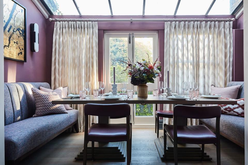<p>Here, Prideaux masterfully utilizes several shades of purple to instill a sense of easy-going elegance into this London dining room. The inviting dining space is home to purple walls, a purple textured banquette fabric, burgundy leather dining chairs, and lilac cushions for a purple lover's paradise. </p><p>"In general, when adding purple into a scheme, I like to use other tones from the same family of colors," says Prideaux. "Mauve paired with pale lilac and a hint of pink look lovely when blended throughout various finishes in a room."</p>