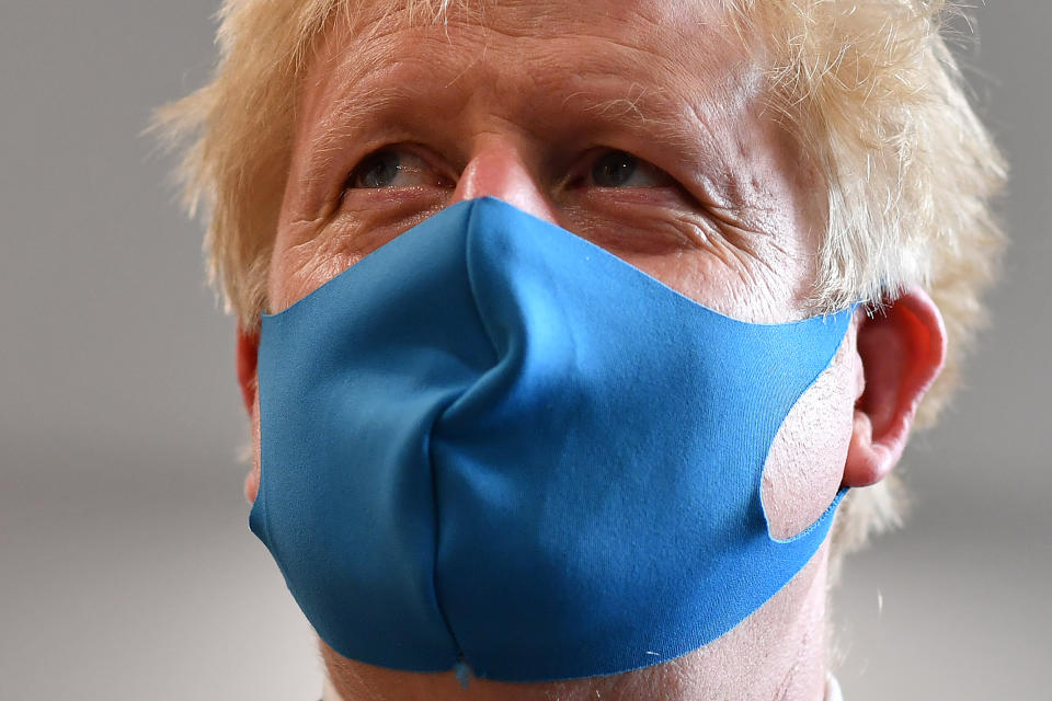LONDON, UNITED KINGDOM - JULY 13: Britain's Prime Minister Boris Johnson, wearing a face mask or covering due to the COVID-19 pandemic, visits the headquarters of the London Ambulance Service NHS Trust  on July 13, 2020 in London, England.  (Photo by Ben Stansall-WPA Pool/Getty Images)
