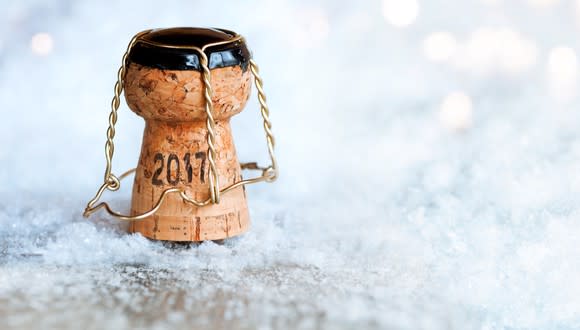 Champagne cork with 2017 written on it.