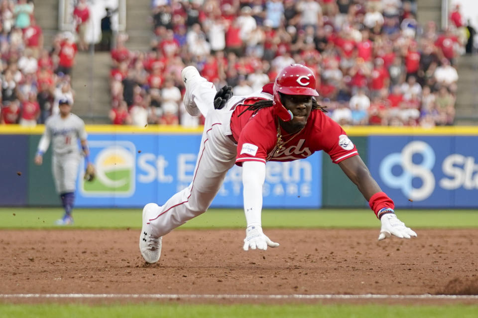 Cincinnati Reds' Elly De La Cruz dives into third base after hitting a triple against the Los Angeles Dodgers in the third inning of a baseball game in Cincinnati, Wednesday, June 7, 2023. (AP Photo/Jeff Dean)