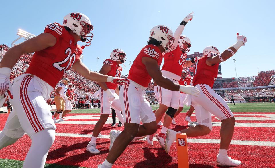 Utah Utes linebacker Karene Reid (21) celebrates his pick six against the UCLA Bruins in Salt Lake City on Saturday, Sept. 23, 2023.