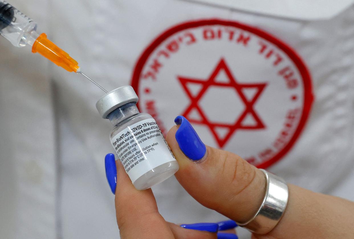 An Israeli medical worker prepares a dose of the Pfizer/BioNTech Covid-19 vaccine  (AFP via Getty Images)