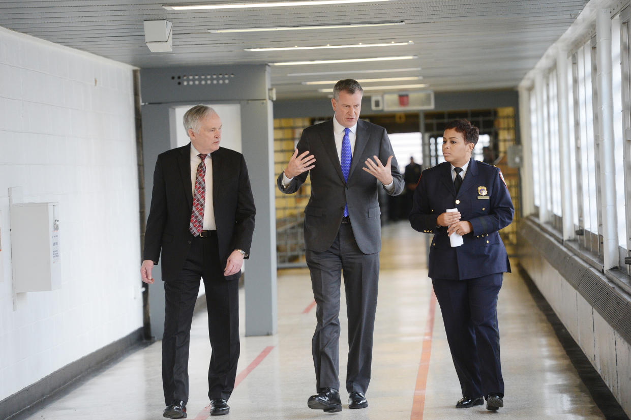 Then-New York City Mayor Bill de Blasio, with Department of Correction Commissioner Joe Ponte and warden Becky Scott, tours Second Chance Housing at Rikers Island in 2014. 