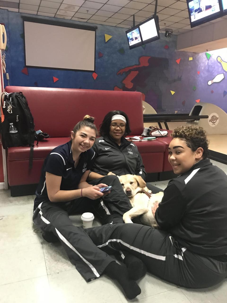 Petra, a golden retriever seeing-eye dog, was an honorary member of the Lincoln University women’s bowling team before it was cut.