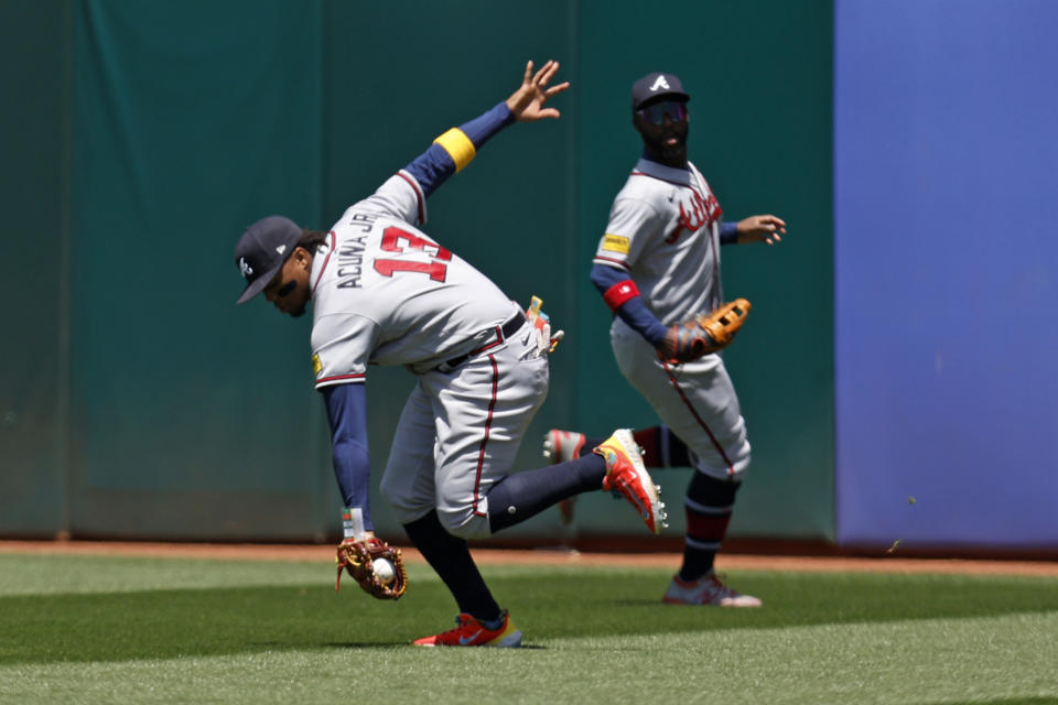 Atlanta Braves right fielder Ronald Acuna Jr. (13) catches a ball hit Oakland Athletics' Seth Brown during the sixth inning of a baseball game in Oakland, Calif., Thursday, May 31, 2023. (AP Photo/Jed Jacobsohn)