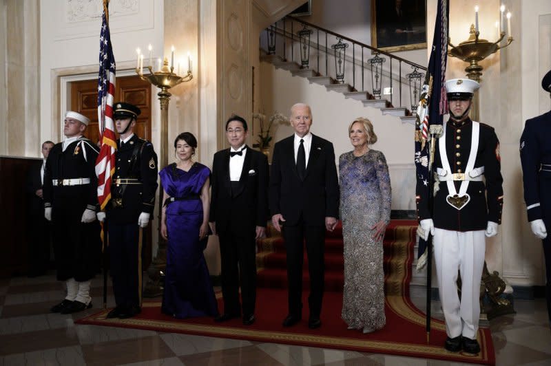 U.S. President Joe Biden (CR) and First Lady Jill Biden greet Japanese Prime Minister Kishida Fumio (next to Biden) and Mrs. Kishida Yuko in April as they arrive for a State Dinner at the White House the day before the trilateral meeting with the Philippines' president. Photo by Yuri Gripas/UPI