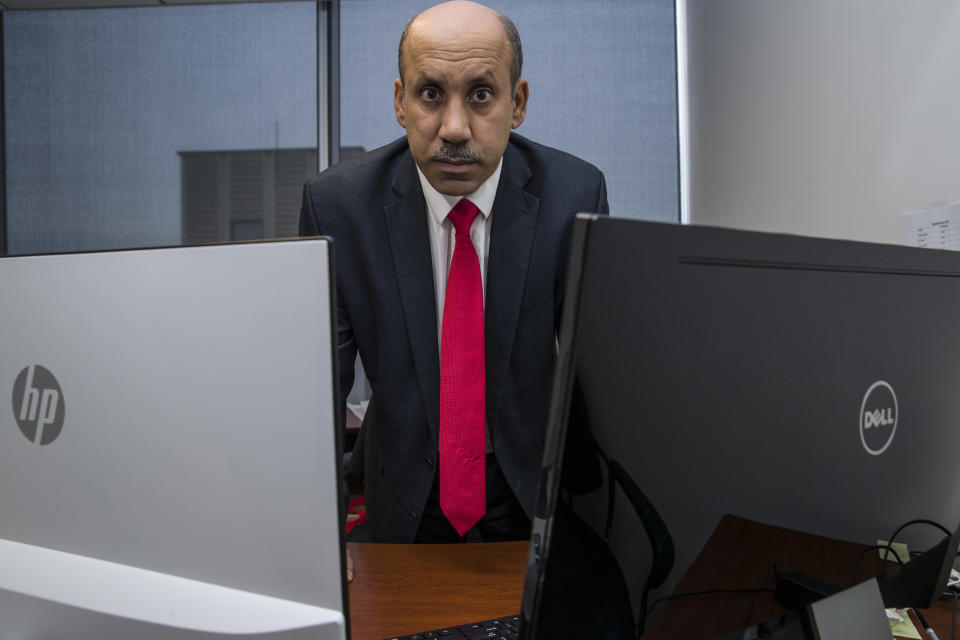 In this Oct. 26, 2018, photo Ali AlAhmed poses for a photograph in his office in Washington. Hackers are impersonating reporters in a bid to intercept the communications of the prominent Saudi opposition figure in Washington. An Associated Press review of malicious emails sent to AlAhmed shows he was approached by hackers masquerading as a BBC reporter and as Washington Post columnist Jamal Khashoggi, who was killed last month at the Saudi consulate in Istanbul. The emails were attempts to break into AlAhmed’s inbox. AlAhmed blames the Saudi government for the hacking campaign, although the AP has yet to find any forensic evidence to back that.(AP Photo/Alex Brandon)