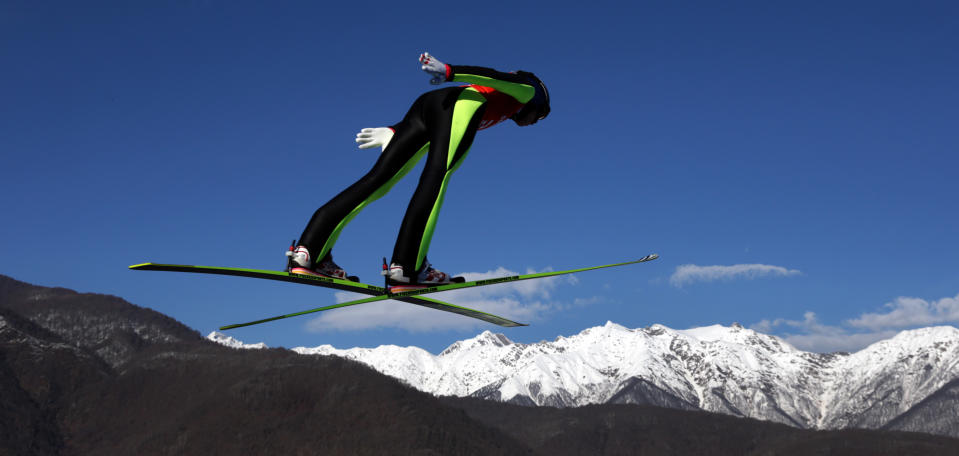 Austria's Daniela Iraschko-Stolz soars through the air during a women's ski jumping training session at the 2014 Winter Olympics, Saturday, Feb. 8, 2014, in Krasnaya Polyana, Russia. (AP Photo/Matthias Schrader)